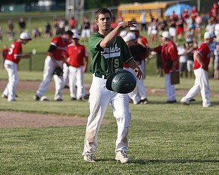 Ursuline's#9 Joel Hake laments their loss as Orrville celebrates victory.