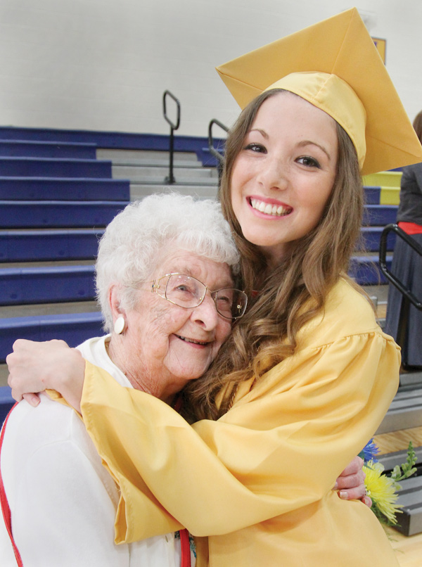 Halle Moran, 2014 Lowellville graduate hugs her great-grandmother, Doris Burns, during Sunday’s 
commencement ceremony at Lowellville High School. Burns, a 1935 Lowellville High graduate, was introduced at the ceremony as the oldest living Lowellville alumnus.
