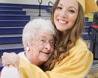 Halle Moran, 2014 Lowellville graduate hugs her great-grandmother, Doris Burns, during Sunday’s
commencement ceremony at Lowellville High School. Burns, a 1935 Lowellville High graduate, was introduced at the ceremony as the oldest living Lowellville alumnus.