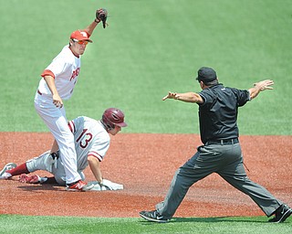 Youngstown State infielder Phil Lipari shows the ball to the umpire after tagging baserunner Austin Slater of Stanford on a steal attempt during the second inning of Sunday’s NCAA regional elimination game at Bart Kaufman field. Slater was safe and the Cardinals won 12-4.