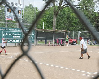 A softball game was one of the contests played Monday at the Mill Creek Junior Baseball League’s Kramer Field
complex on Youngstown’s West Side. The league was founded 60 years ago.