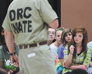 Ohio Department of Rehabilitation and Correction inmate Paul Fitzpatrick of the Grafton Correctional Institution in Grafton, Ohio, talks to eighth grader Taylor Davies and other students at W.S. Guy Middle School in Liberty.
