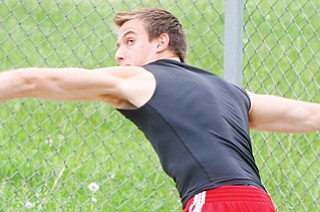 Canfield sophomore Andrew Hallof practices throwing the discus at Wednesday’s practice at Canfield High School. He will compete in the event at this weekend’s Division I state track and field meet in Columbus.