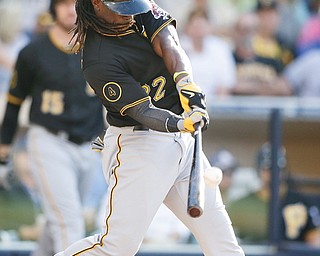 Pittsburgh’s Andrew McCutchen hits a fly ball while batting against San Diego during the eighth inning Wednesday night. The Padres beat the Pirates, 3-2.