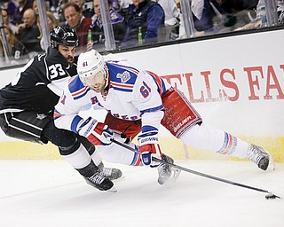 New York Rangers left wing Rick Nash, right, skates around Los Angeles Kings defenseman Willie Mitchell during the first period of Game 1 in the Stanley Cup Final on Wednesday night.