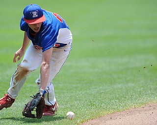 COLUMBUS, OHIO - JUNE 5, 2014: Infielder Tristin Bova #23 of Reserve backhands the baseball before making a bad throw to first that would allow a run to score in the bottom of the 2nd inning during a OHSAA state semi-final game at Huntington Park. Newark Catholic won 6-2. (Photo by David Dermer/Youngstown Vindicator)
