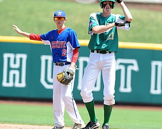COLUMBUS, OHIO - JUNE 5, 2014: Base runner Conor Keck #21 of Newark Catholic celebrates after hitting a 2 RBI double in the bottom of the 6th inning during a OHSAA state semi-final game at Huntington Park. Newark Catholic won 6-2. (Photo by David Dermer/Youngstown Vindicator) Reseve #2 Walker Marlowe pictured.