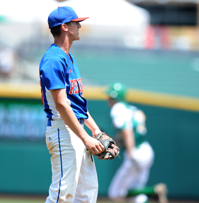 COLUMBUS, OHIO - JUNE 5, 2014: Pitcher Tristan Bova #23 of Reserve watches as the baseball drops in the outfield allowing a run to score in the bottom of the 6th inning during a OHSAA state semi-final game at Huntington Park. Newark Catholic won 6-2. (Photo by David Dermer/Youngstown Vindicator)
