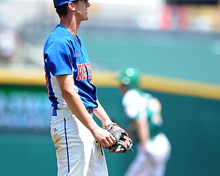 COLUMBUS, OHIO - JUNE 5, 2014: Pitcher Tristan Bova #23 of Reserve watches as the baseball drops in the outfield allowing a run to score in the bottom of the 6th inning during a OHSAA state semi-final game at Huntington Park. Newark Catholic won 6-2. (Photo by David Dermer/Youngstown Vindicator)