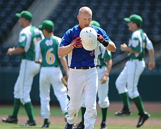 COLUMBUS, OHIO - JUNE 5, 2014: Jon Timko #3 of Reserve walks to the dugout after being stranded on base after the end of the top of the 7th inning while players from Newark Catholic celebrate behind him during a OHSAA state semi-final game at Huntington Park. Newark Catholic won 6-2. (Photo by David Dermer/Youngstown Vindicator)