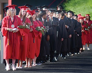Soon-to-be graduates of Campbell Memorial High School line the track at Campbell Memorial Stadium before the start of Thursday’s commencement. This year’s graduating class had 76 students.