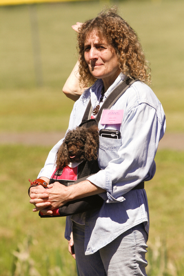        ROBERT K. YOSAY  | THE VINDICATOR..Dianna Sippl and 'shiloh' her minature poodle.. enjoy the ribbon cutting. .Animal Welfare League of Trumbull county ribbon cutting on Belmont Ave across from Squaw Creek in Vienna.
