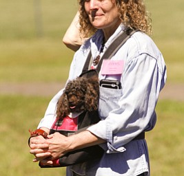 ROBERT K. YOSAY | THE VINDICATOR..Dianna Sippl and 'shiloh' her minature poodle.. enjoy the ribbon cutting. .Animal Welfare League of Trumbull county ribbon cutting on Belmont Ave across from Squaw Creek in Vienna.