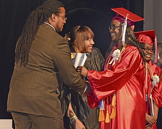 Katie Rickman | The Vindicator.Tryra Withers receives her diploma from Ronald Shadd at the Chaney High School Commencement June 6, 2014.