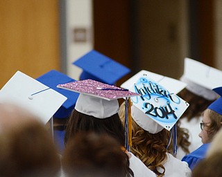 Katie Rickman | The Vindicator.Students with decorated hats sit in the audience at Jackson Milton's graduation June 6 ,2014.