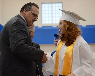 Katie Rickman | The Vindicator .Valedictorian Victoria Wolfe shakes hands with Jackson Milton Superintendent Kirk Baker after receiving her diploma June 6, 2014.