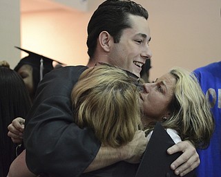 Katie Rickman | The Vindicator.John Meadows hugs his his Aunts Kathy Barschows (left) of New Jersey and Cynthia Alonge of New York after graduating from Mahoning County High School. The day was an emotional day for the family as John's mother Deborah Meadows passed away two years ago in August.