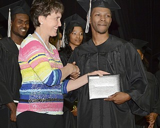 Katie Rickman | The Vindicator.Stacy Rutana, a teacher at Mahoning County High School hands Devlin Simpson his.