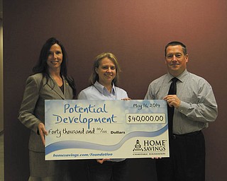 SPECIAL TO THE VINDICATOR
The Potential Development Program recently received a $40,000 donation from Home Savings Charitable Foundation. The funds will be used for renovations for the new High School for Autism. From left are Pamela Kimmel, director of Home Savings Charitable
Foundation; Angela Crofford, board president of Potential Development; and Paul
Garchar, executive director of Potential Development. For information about the Potential Development Program and its services, call 330-746-7641 or visit www.4pdp.org/.