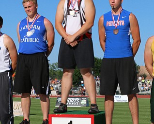 Bucyrus Palo of Newton Falls stands atop the podium after winning the states Division 3 Boys discus at the Jesse Owens Memorial Stadium in Columbus, Ohio, Friday, June 6, 2014. (Photo/Mark Hall)
