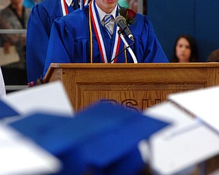Kelli Cardinal/The Vindicator.Valedictorian Matthew Slaven speaks to his fellow graduates Sunday during the commencement ceremony at Poland Seminary High School.
