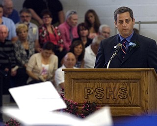 Kelli Cardinal/The Vindicator.Michael Masucci speaks to the graduates, their friends and family Sunday during the commencement ceremony at Poland Seminary High School.