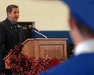 Kelli Cardinal/The Vindicator.Michael Masucci speaks to the graduates, their friends and family Sunday during the commencement ceremony at Poland Seminary High School.