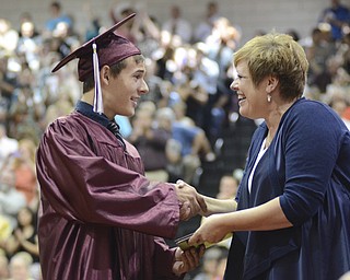 Jon Bailic recieves his diploma from Kimberly Poma Board of Education President.