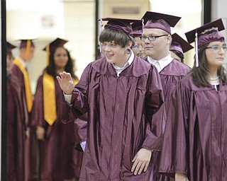 Katie Rickman | The Vindicator.Vincent Cook waves to family and friends as Boardman's class of 2014 files into the gymnasium June 8, 2014.