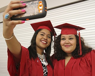William D Lewis The Vindicator Canfield 2014 grads Queen-Amina Adaego Chijide, left, and Haylee Barker take a selfie before Sunday commencement at CHS.