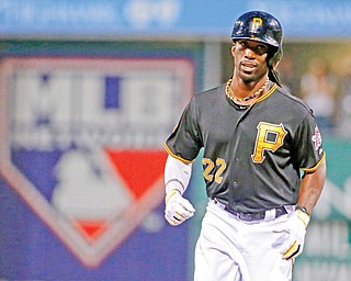 The Pirates’ Andrew McCutchen rounds second after hitting a two-run home run off Cubs starting pitcher Jason
Hammel during the first inning of their baseball game Wednesday at PNC Park in Pittsburgh. McCutchen reached base four times in the Pirates’ 4-2 win.