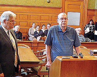 John Bruce Barton spoke in court to Judge Ronald Rice on Wednesday asking for former Niles funeral director Robert P. McDermott Sr. to receive 20 years in prison for the theft of $270,000 from about 50 of his former customers, including Barton. At left is Chuck Morrow, assistant Trumbull County prosecutor. Many other victims were in the courtroom behind Barton.
