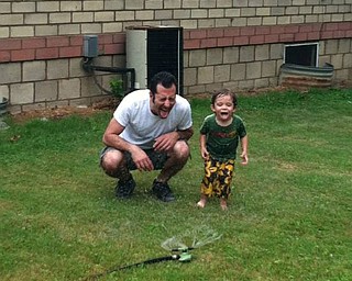 Tony Chance of Sharpsville, Pa., enjoyed Father's Day in 2013 with his son Jack Chance, 2. This was the first time Jack went under the sprinkler and he and his dad had a blast! Sent by Mary Ellen Chance of Youngstown.