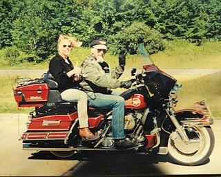 Lori Gerner of East Palestine says, "The best way to see these United States is on a Harley," riding with her dad, Chuck Cavanaugh of New Middletown.