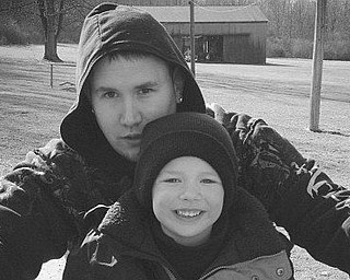 Ethan Sheets, 8, with his dad, Chris Hartman, of Canfield, having a fun day at great-grandma's house. Sent by Nana Lani Hartman.