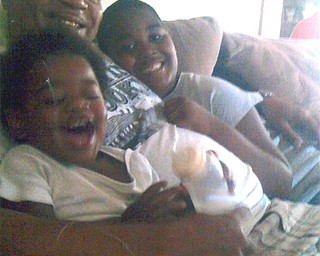 Jerome Givens with his sons Maleik, left, and Isiah.