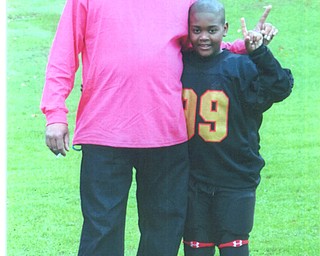 Jerome Givens and his son Isiah are agreeing they are Number One!