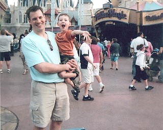 Patrick Huly with his son, Ethan, at the Magic Kingdom.