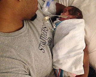 AJ Aponte is holding his son Li'l AJ for the first time. Submitted by Milly Aponte of Youngstown.