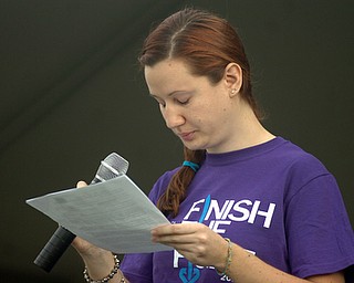 Kelli Cardinal/The Vindicator.Nicole Novotny, 23, of Youngstown, pauses before thanking her parents Friday while speaking about her own battle with cancer during the 2014 Austintown Relay For Life event in Austintown Township Park. Novotny was diagnosed with Non Hodgkin's Lymphoma at age 19.