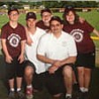 Very special coach and dad Bill Timmerman is shown with his adopted special-needs children in their Challenger baseball picture. Sent by mom, Sandee Timmerman.