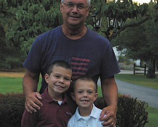 Proud Papa Ken Tirpack of Boardman with his grandsons, Gavin Ward, 8, and Andy Ward, 6, both of Poland, are ready for the first day of school at St. Charles in 2013. Sent by Jen Ward.