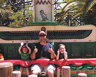 CONGRATULATIONS TO THE WINNER: It's thumbs-up for Kurt DiLisio and his two sons, Gino, 5, and Rocco, 7, as they get ready to ride the Beetle Bounce during a visit to Legoland in April 2013. Kurt's wife, Jennifer, submitted the winning photo. The family lives in Canfield. As the winners of this year's photo drawing, the guys will share $100 in gift certificates from the Mahoning Valley Scrappers, good toward the purchase of game tickets, merchandise and food.