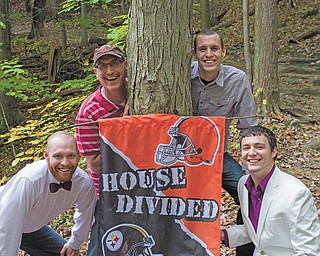 A family divided: Brian, Travis and Tyler Denmeade are Browns fans and Joshua Denmeade is the Steelers fan.