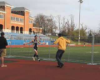 Max Prizant and his dad celebrating after Max broke the school pole vault record. His dad has coached him for four years. Lots of hours of practice resulted in great success and this celebration.