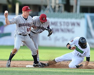 JAMESTOWN, NEW YORK - JUNE 13, 2014: Infielder Austin Fisher #12 of the Scrappers steps on second base to force out baserunner Carl Anderson #18 of Jamestown for the 1st out, while being ran into by teammate Ordomar Valdez #11 in the bottom of the 1st inning during a game at Russell Diethrick Park. (Photo by David Dermer/Youngstown Vindicator)