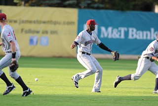 JAMESTOWN, NEW YORK - JUNE 13, 2014: Outfielder Jorge Martinez reacts after watching the baseball drop behind him, outfielder Joel Mejia #6 and infielder Austin Fisher #12, a Jamestown run will score on the play in the bottom of the 1st inning during a game at Russell Diethrick Park. (Photo by David Dermer/Youngstown Vindicator)