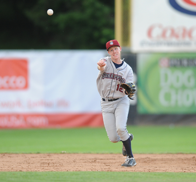 JAMESTOWN, NEW YORK - JUNE 13, 2014: Infielder Austin Fisher #12 of the Scrappers throws the ball to first base for the second out in the top of the 3rd inning during a game at Russell Diethrick Park. (Photo by David Dermer/Youngstown Vindicator)