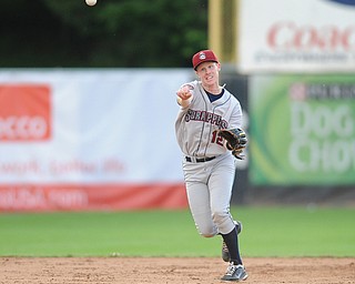 JAMESTOWN, NEW YORK - JUNE 13, 2014: Infielder Austin Fisher #12 of the Scrappers throws the ball to first base for the second out in the top of the 3rd inning during a game at Russell Diethrick Park. (Photo by David Dermer/Youngstown Vindicator)