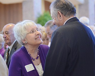 Maryann Jurcisin smiles at her husband, Jerry, as they repeat their wedding vows that they made 55 years ago. They were among the 131 couples who were honored during Sunday’s Wedding Anniversary Celebration at St. Columba Cathedral.